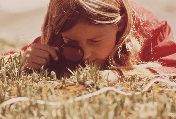 girl with magnifying glass